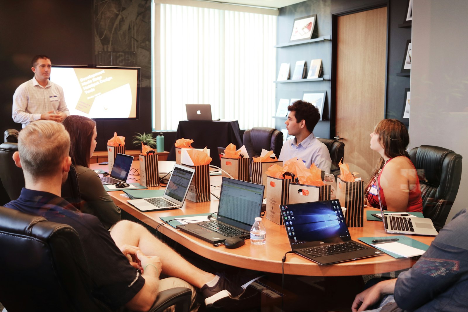 Founders pitching to investors around a table